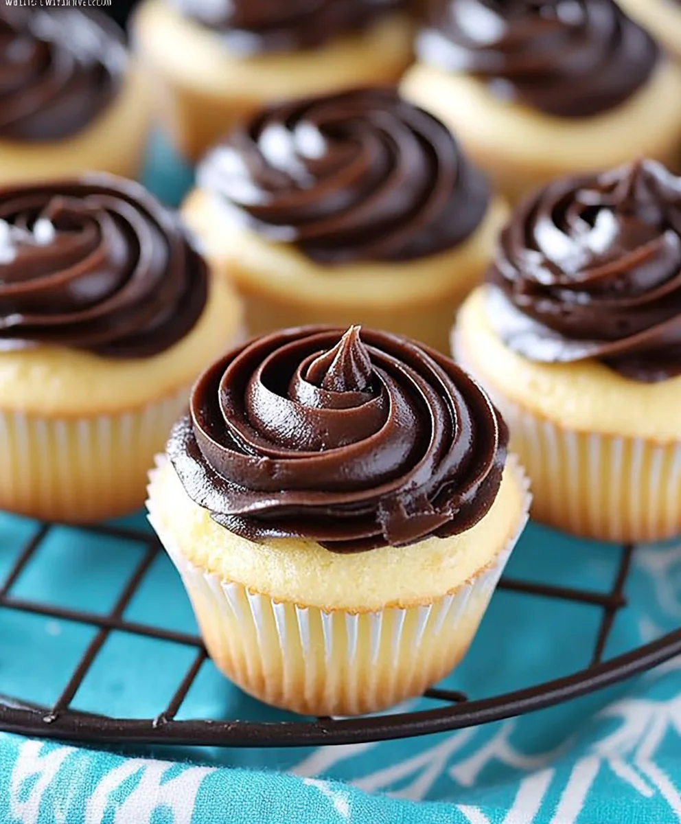 Group of Boston Cream Pie Cupcakes displayed on a wire rack