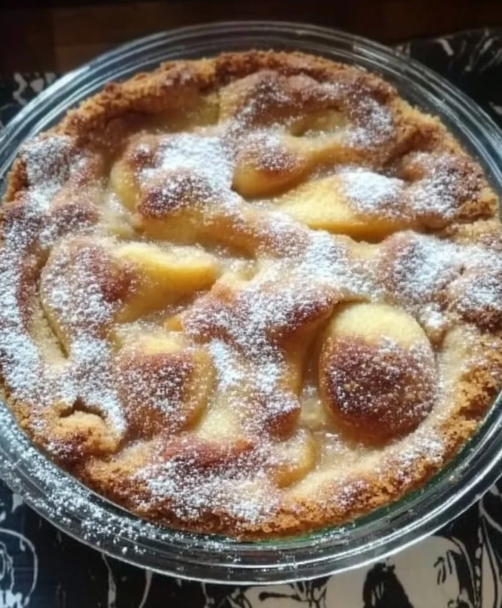 Warm easy peach cobbler with caramelized edges and soft peach filling