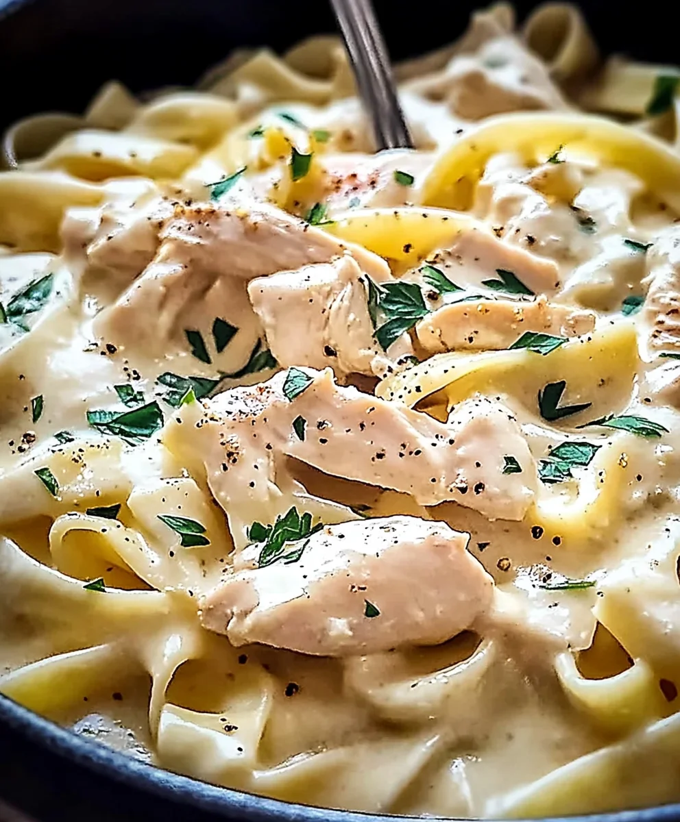 Cheesy one pot chicken Alfredo with tender chunks of chicken and parsley