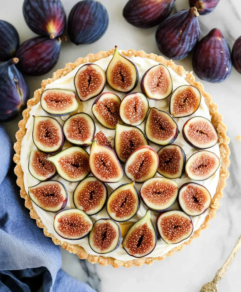 Fig and Honey Mascarpone Tart Served on a Plate with Drizzled Honey