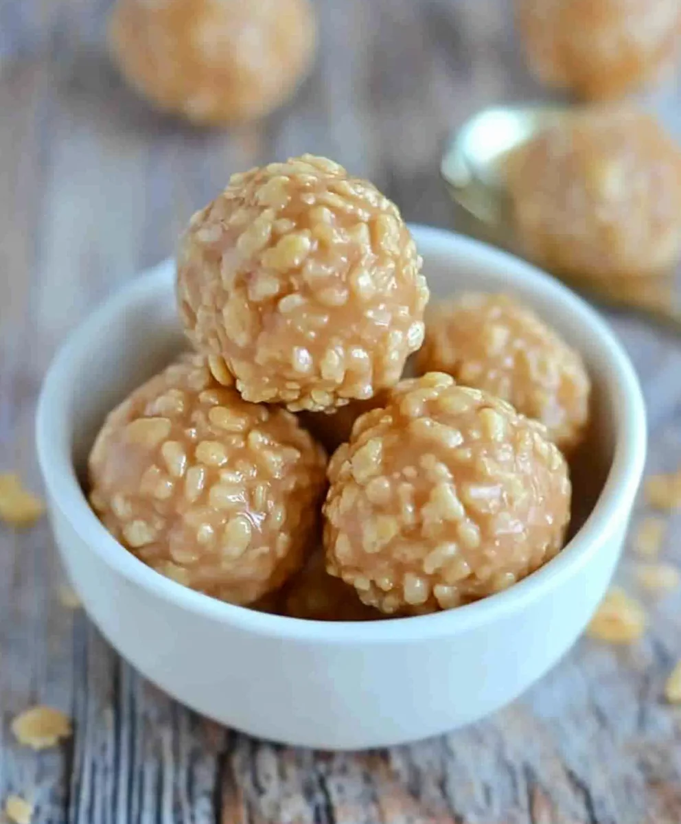No-bake rice crispy peanut butter balls with chocolate drizzle