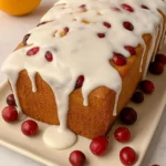 Freshly baked cranberry orange bread with glaze