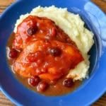 Easy Cranberry Chicken dish served over mashed potatoes