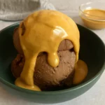 Peanut Butter Magic Shell drizzled on chocolate ice cream