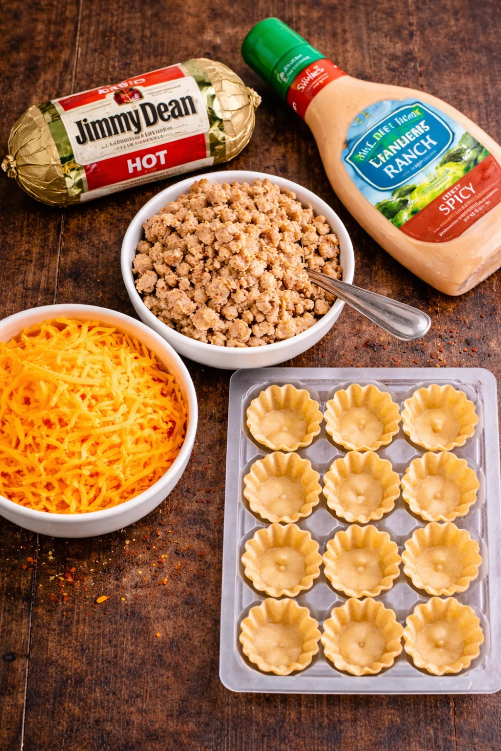 Mini Sausage Tartlets Delight Close-up of mini spicy sausage and cheese tartlets